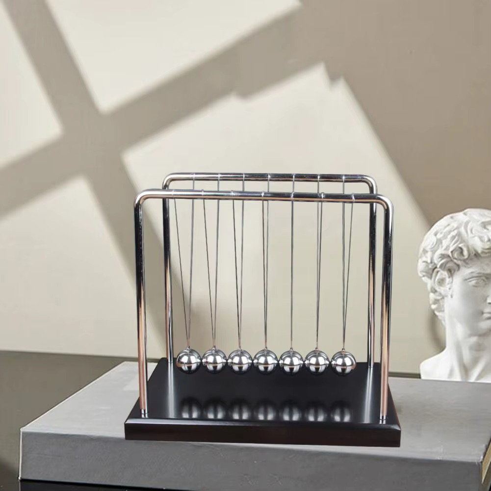 Newton's Cradle physics pendulum desk toy with steel balls demonstrating momentum and energy laws