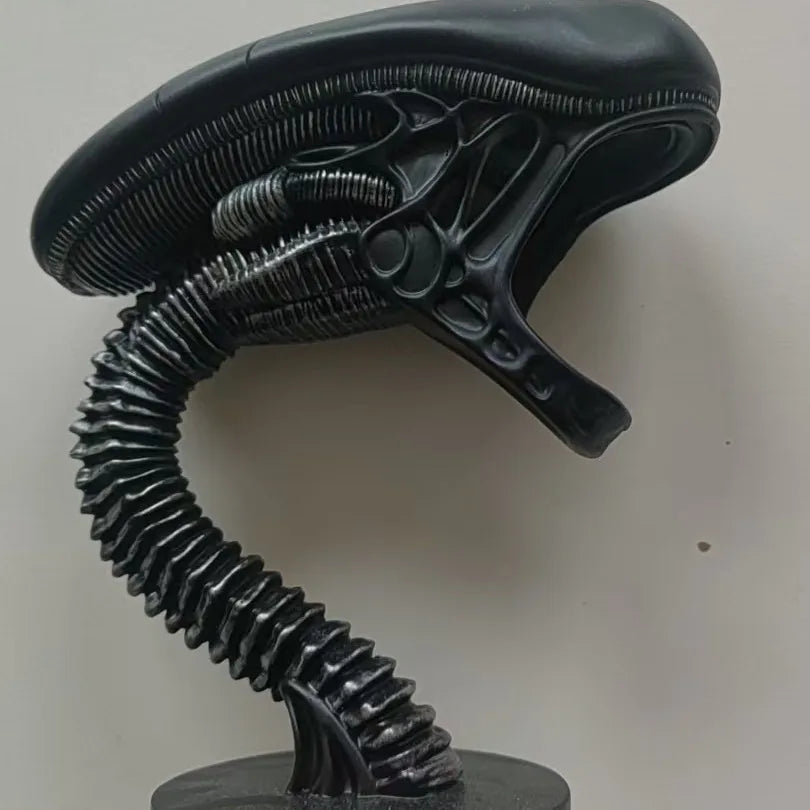 Black alien head with a long neck on a white background -Unique alien creature resin lamp stand for modern home decor