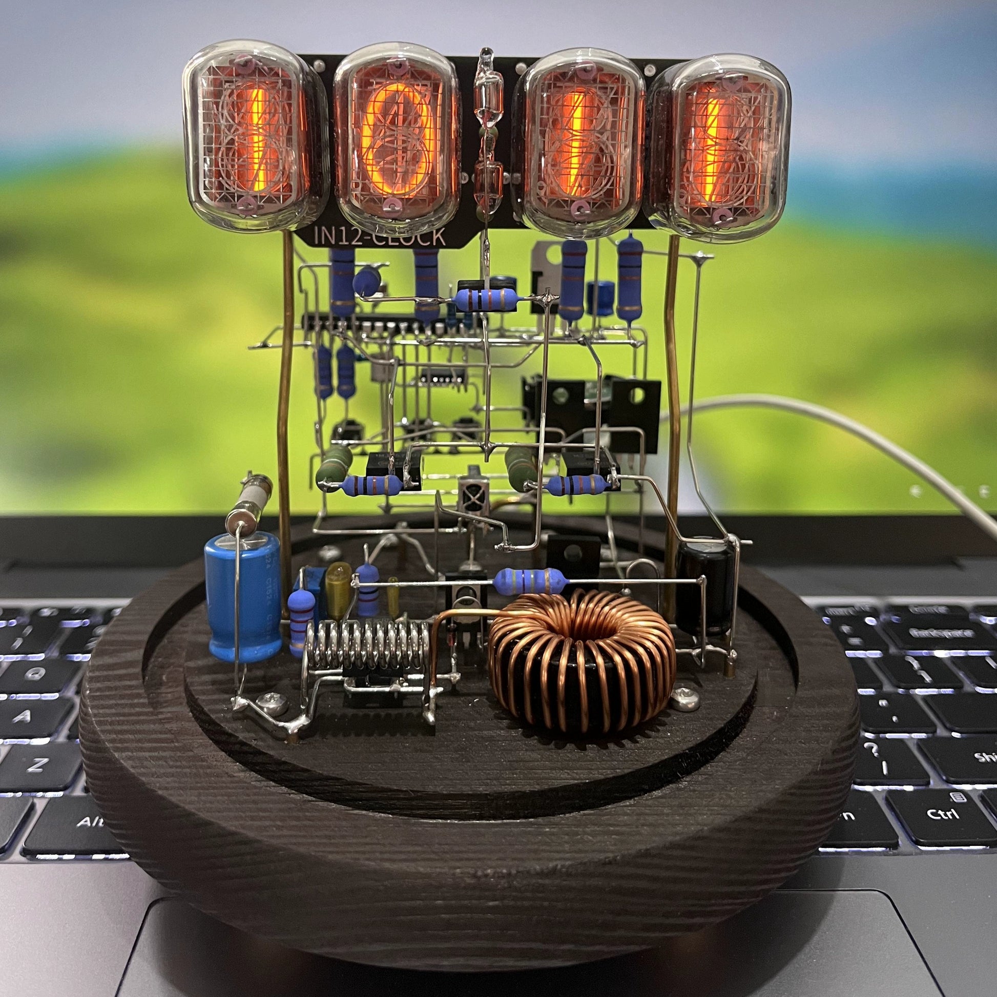 Vintage nixie tube clock with glowing amber display and wooden base from Puzzloria