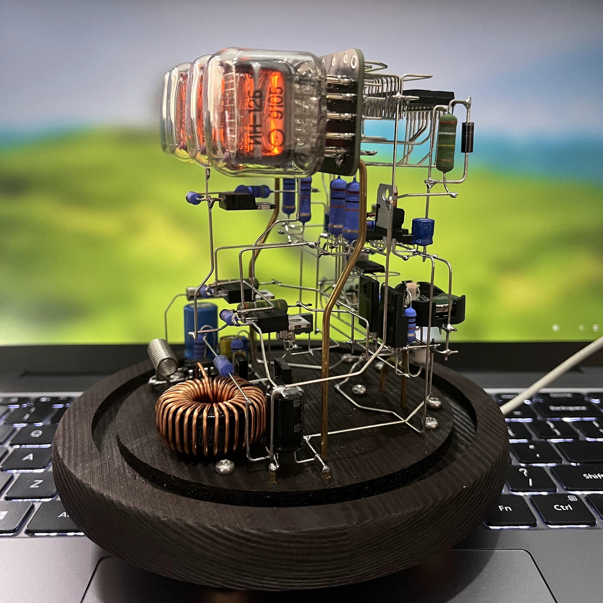 Vintage nixie tube clock with glowing amber display and wooden base from Puzzloria