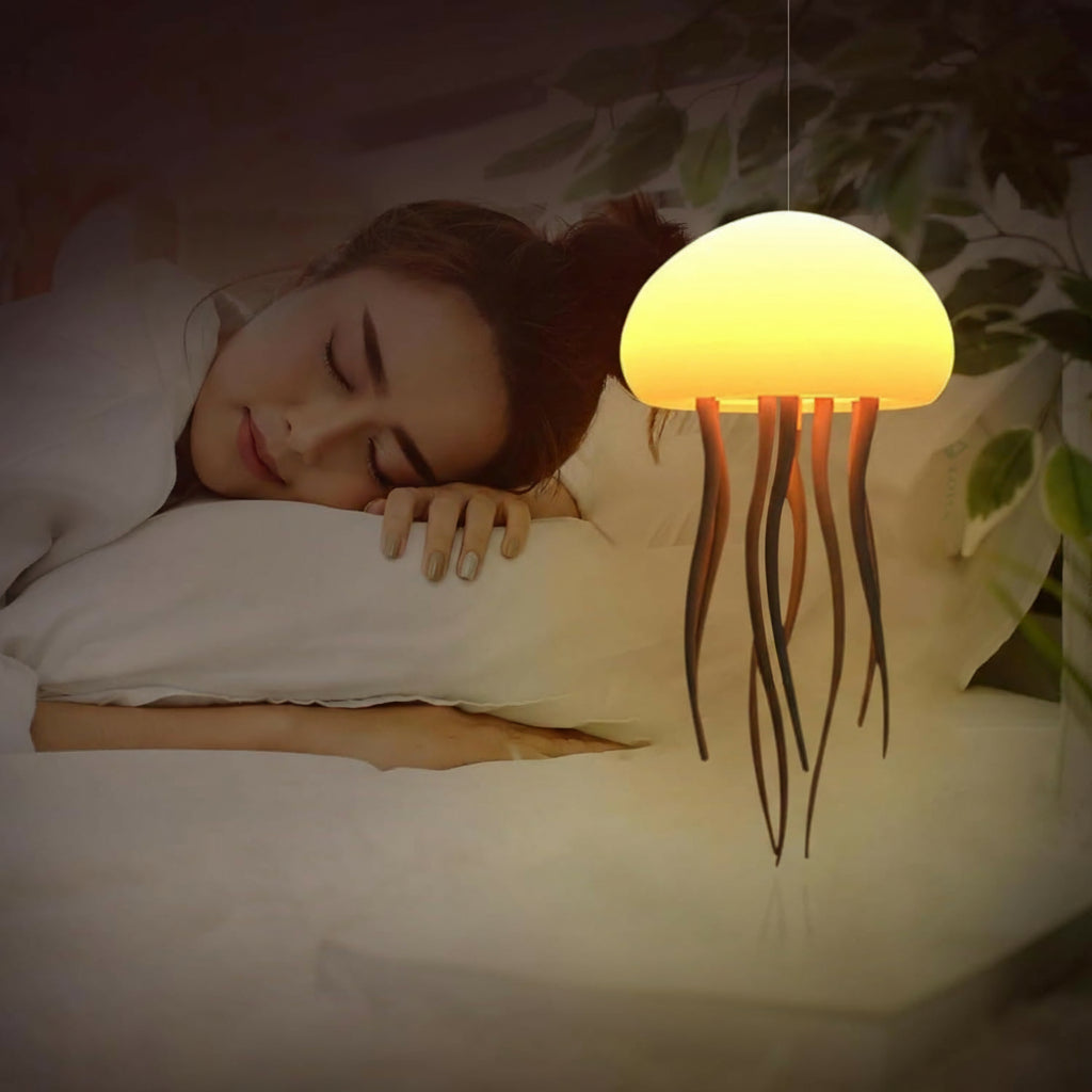 Woman sleeping with a jellyfish-shaped lamp emitting a warm glow.