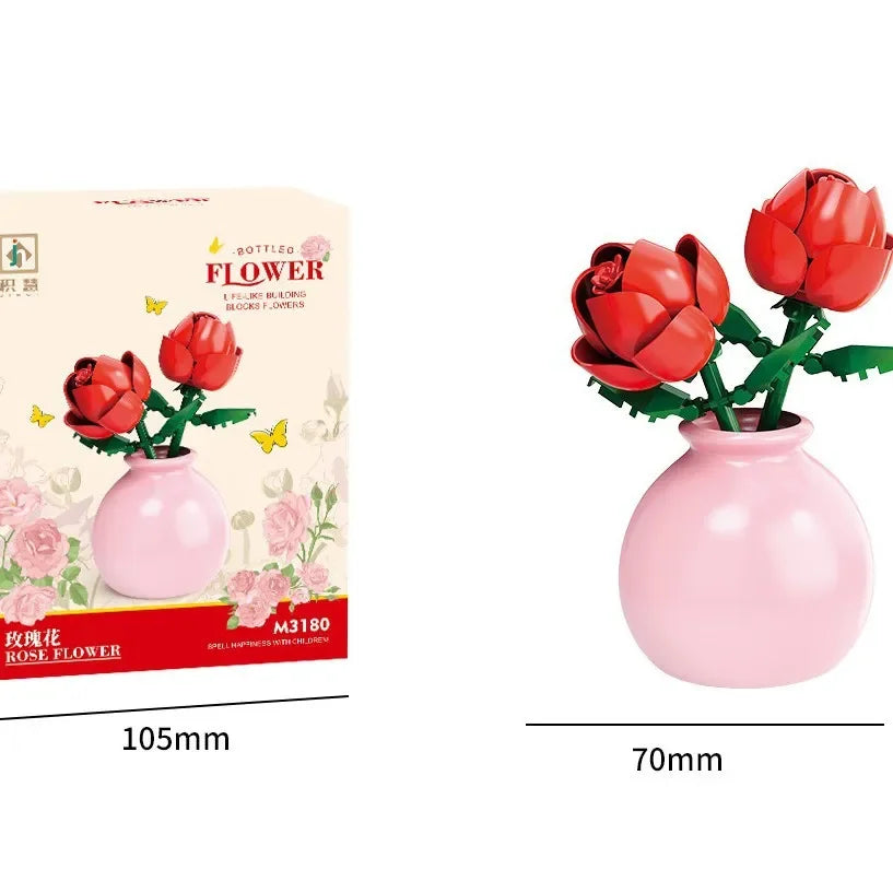 Red rose flower arrangement in a pink vase with packaging on a white background