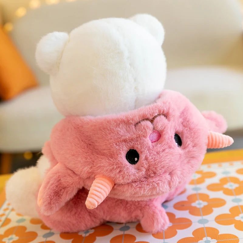 Plush toy with a white top and pink body on a floral-patterned surface