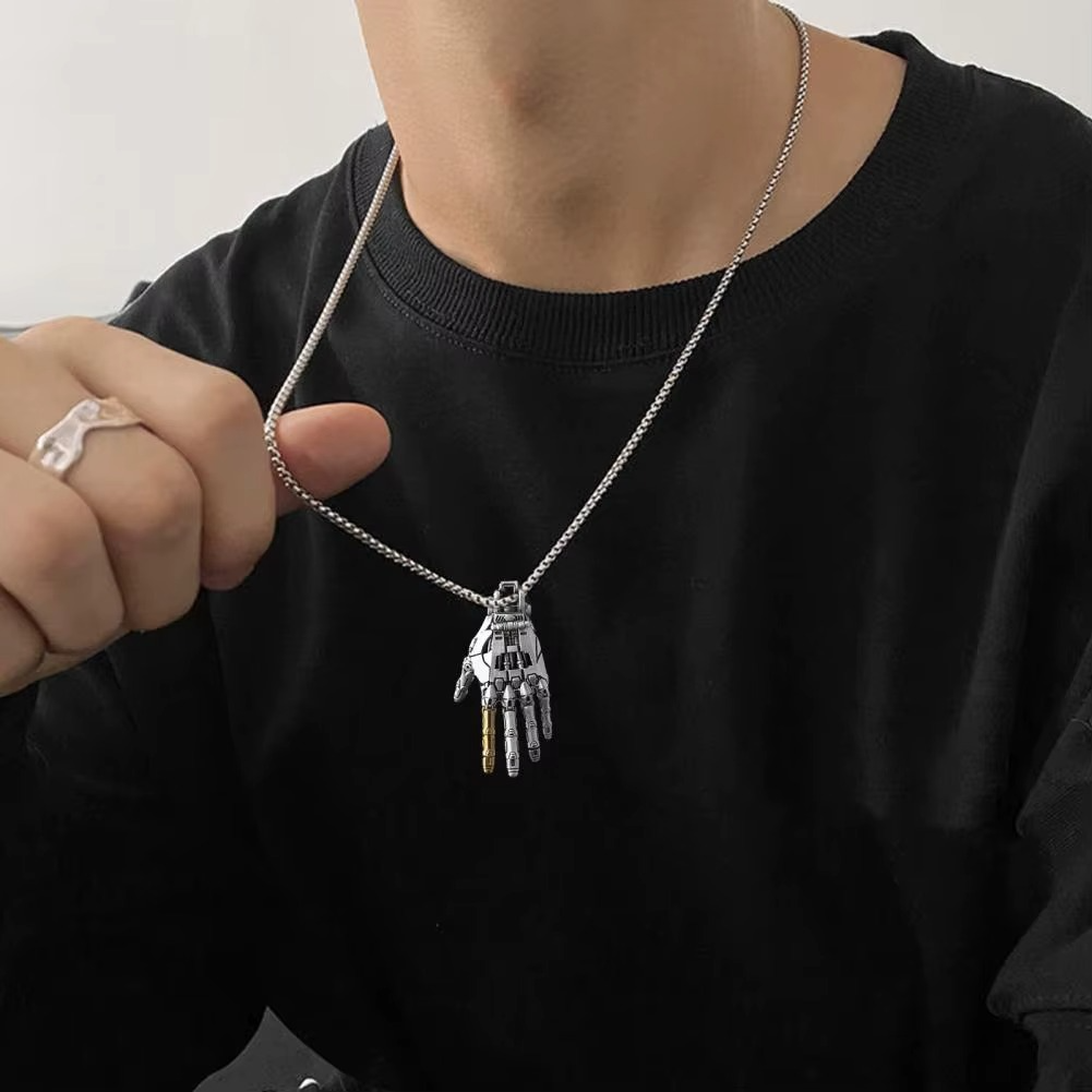 Puzzloria cybernetic hand pendant with articulated joints and steampunk design