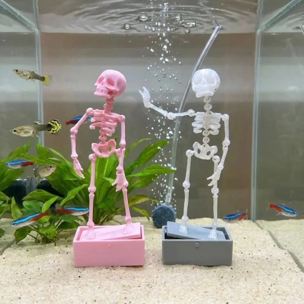skeleton aquarium decor bubbler with airline tubing feeding bubbles into a clean nano tank beside live plants