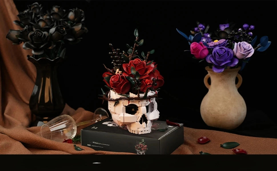 Decorative skull with floral arrangement on a table with vases in the background