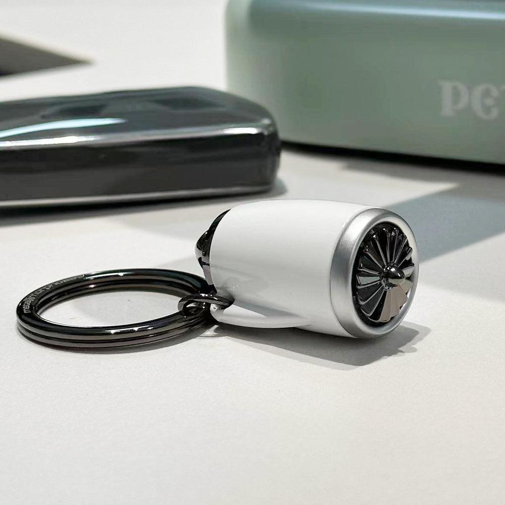 Belgian MTM aircraft turbofan engine keychain with movable rotating blades and interactive design