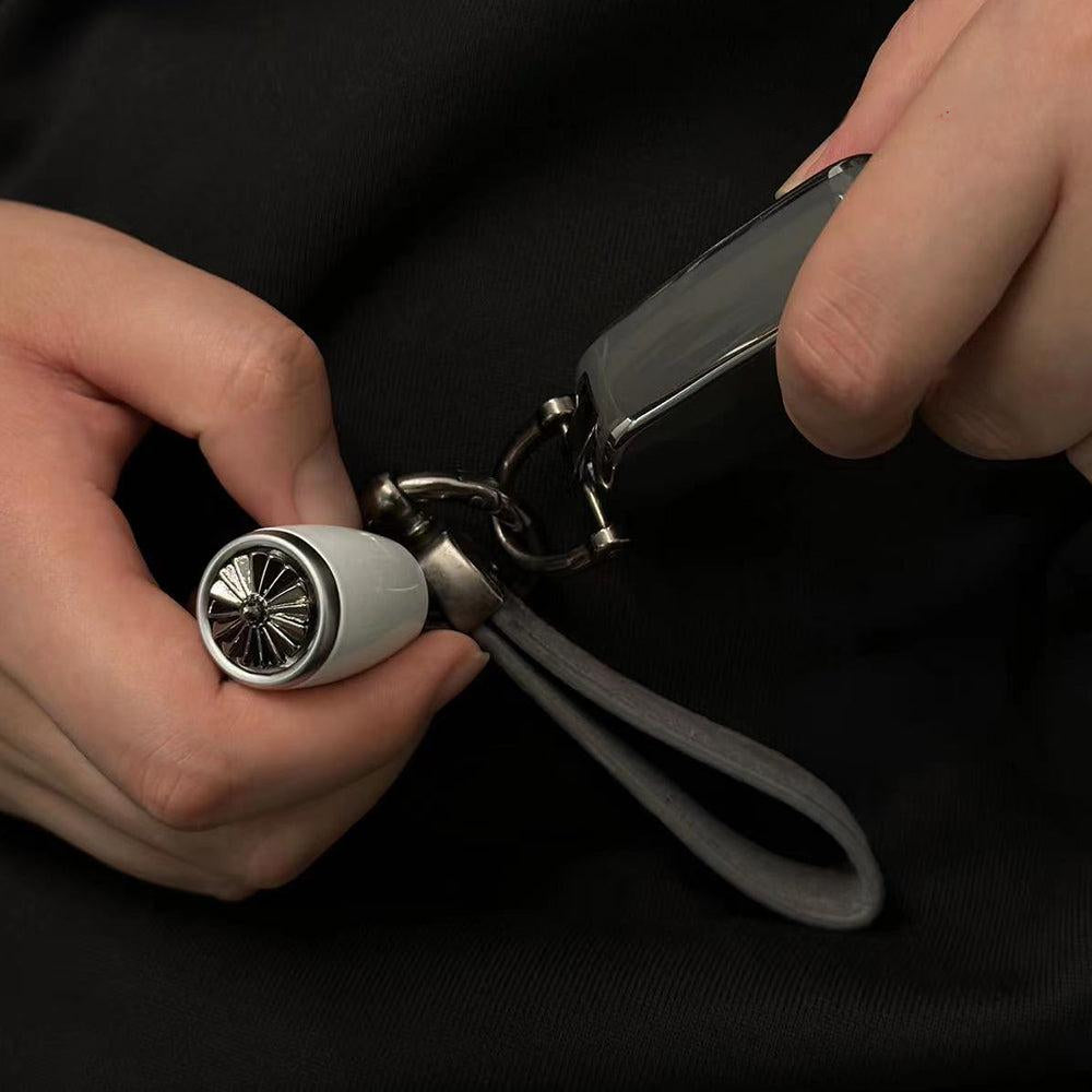 Belgian MTM aircraft turbofan engine keychain with movable rotating blades and interactive design