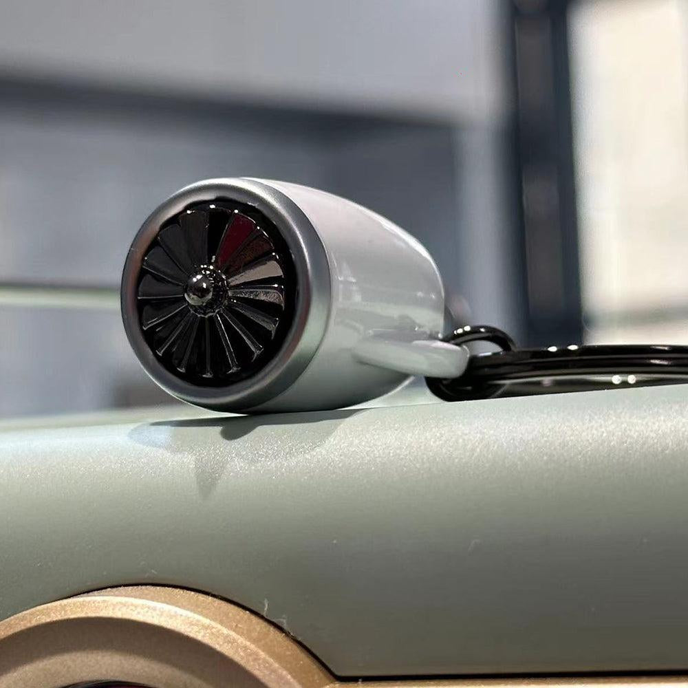 Belgian MTM aircraft turbofan engine keychain with movable rotating blades and interactive design