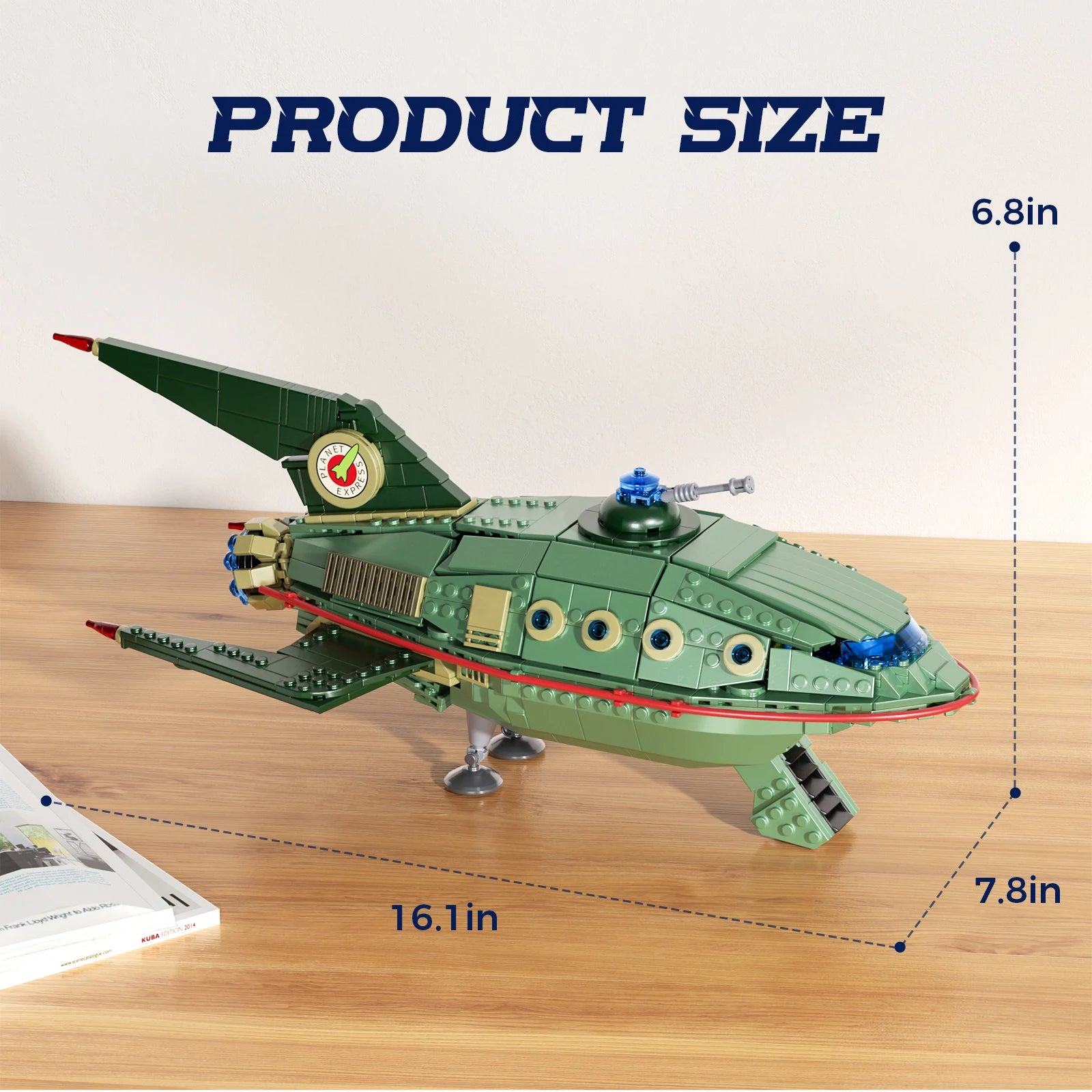 Toy spaceship model on a wooden surface with measurements indicated