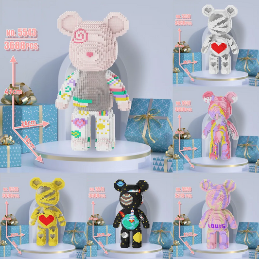 Collection of colorful bear-shaped toys on stands with blue gift boxes in the background. 3688 piece oversized bear character DIY adult educational children's toys birthday gift model building blocks set