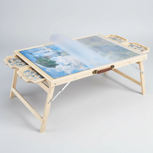 Wooden puzzle table with 4 sorting drawers accommodates 2000-piece jigsaws. Foldable legs, protective cover, and 10 adhesive sheets. Arrives fully assembled.