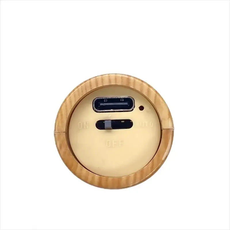 Round wooden device with USB and HDMI ports on a white background