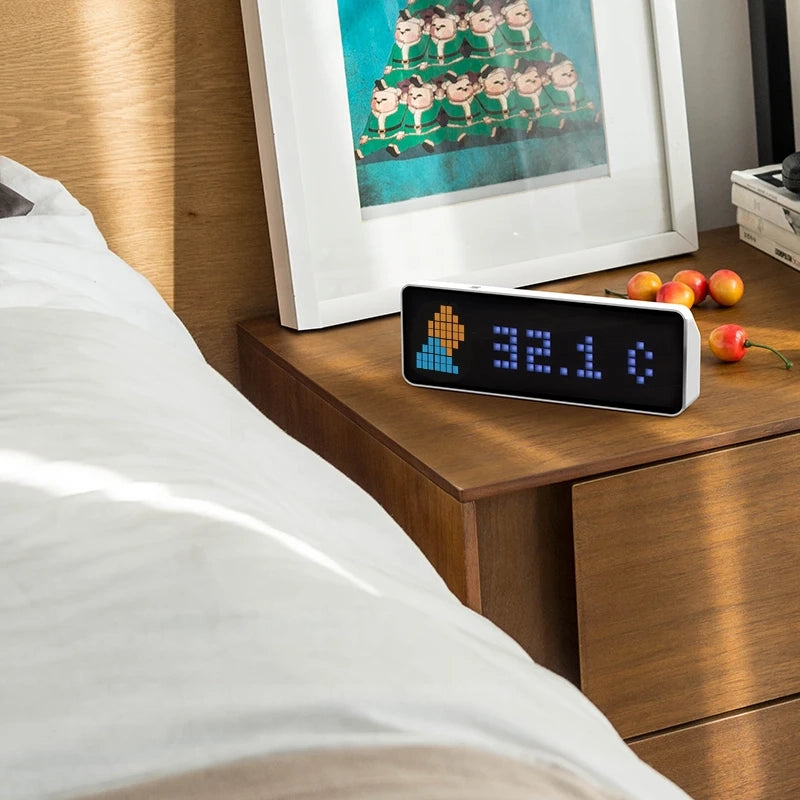 Smart pixel clock followers counter display with LED screen showing social media data, weather, and time