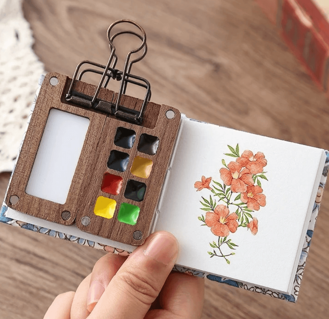 Open walnut wood pocket travel watercolor palette with six colors and a refillable water brush