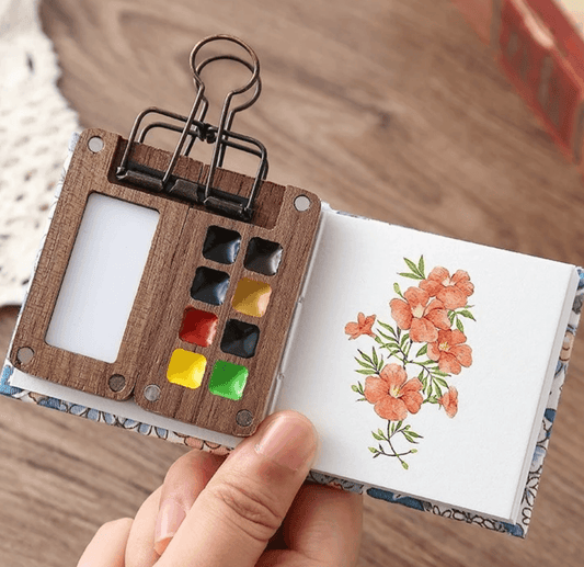 Open walnut wood pocket travel watercolor palette with six colors and a refillable water brush