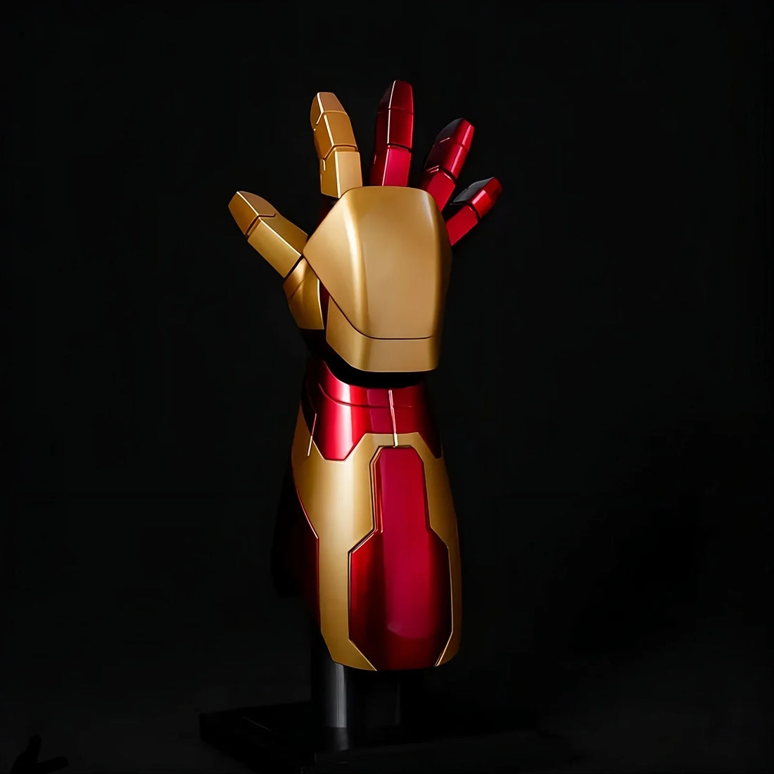 Iron Man Mark 42 wearable gauntlet and arm with LED palm repulsor on a display stand, premium Marvel cosplay replica for adults