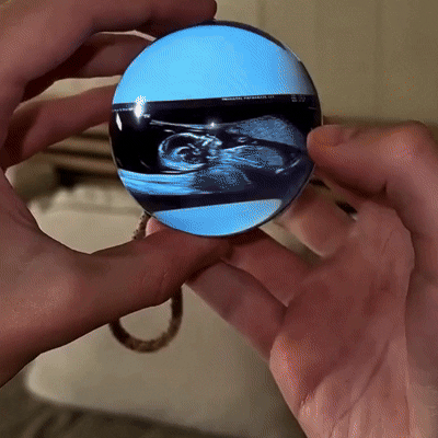 Custom video crystal ball memory orb with LED light base displaying 3D photos and videos