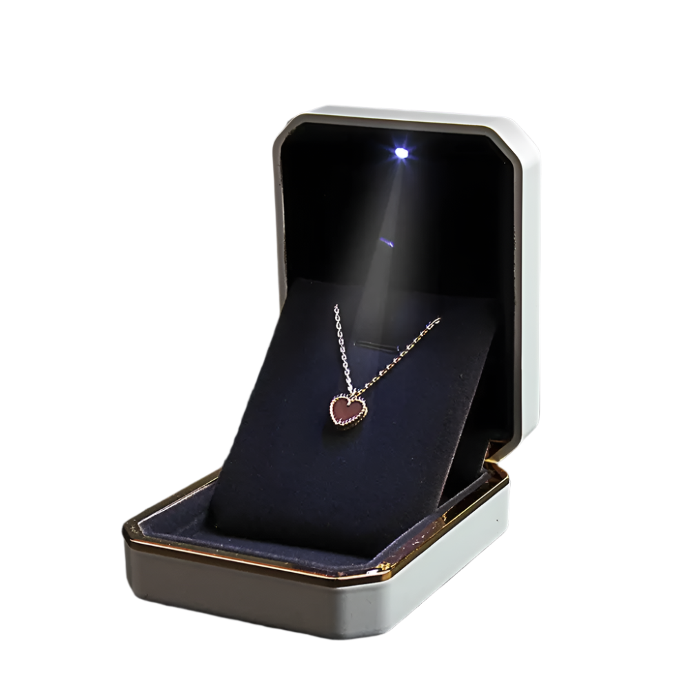 Jewelry box with a heart-shaped pendant inside LED ring box with automatic light for engagement proposals and wedding jewelry display