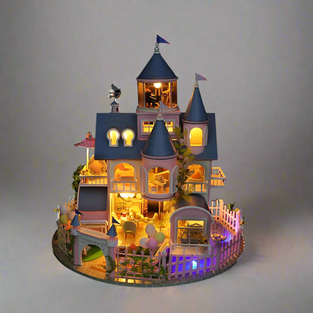 Toy castle with illuminated interior on a gray background