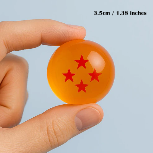 Orange sphere with red star pattern held by a hand against a light blue background