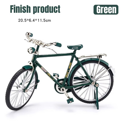 Green model bicycle on a white background with dimensions displayed.