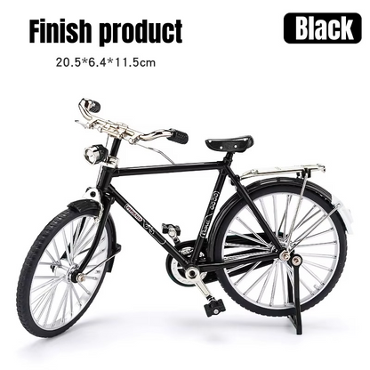 Black miniature bicycle model on a white background with text indicating dimensions and color.
