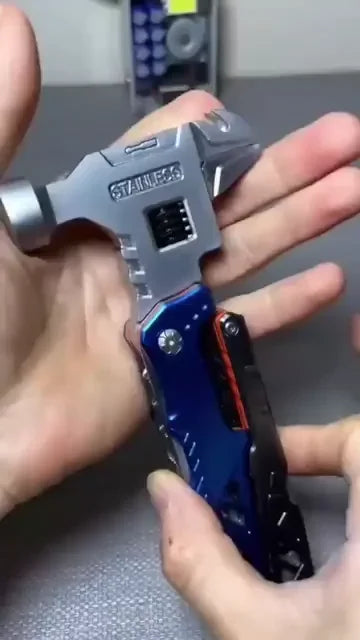 compact multitool hammer held in hand showing folding wrench head and knurled grip for camping and diy jobs (Blue)
