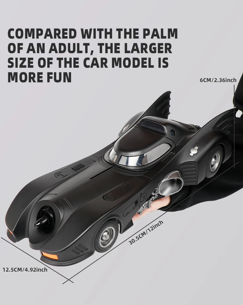 1989 Batmobile diecast model car size 30.5 x 12.5 x 6 cm compared with an adult palm, 1/18 Batman car, 1989 Black