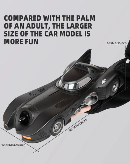 1989 Batmobile diecast model car size 30.5 x 12.5 x 6 cm compared with an adult palm, 1/18 Batman car, 1989 Black