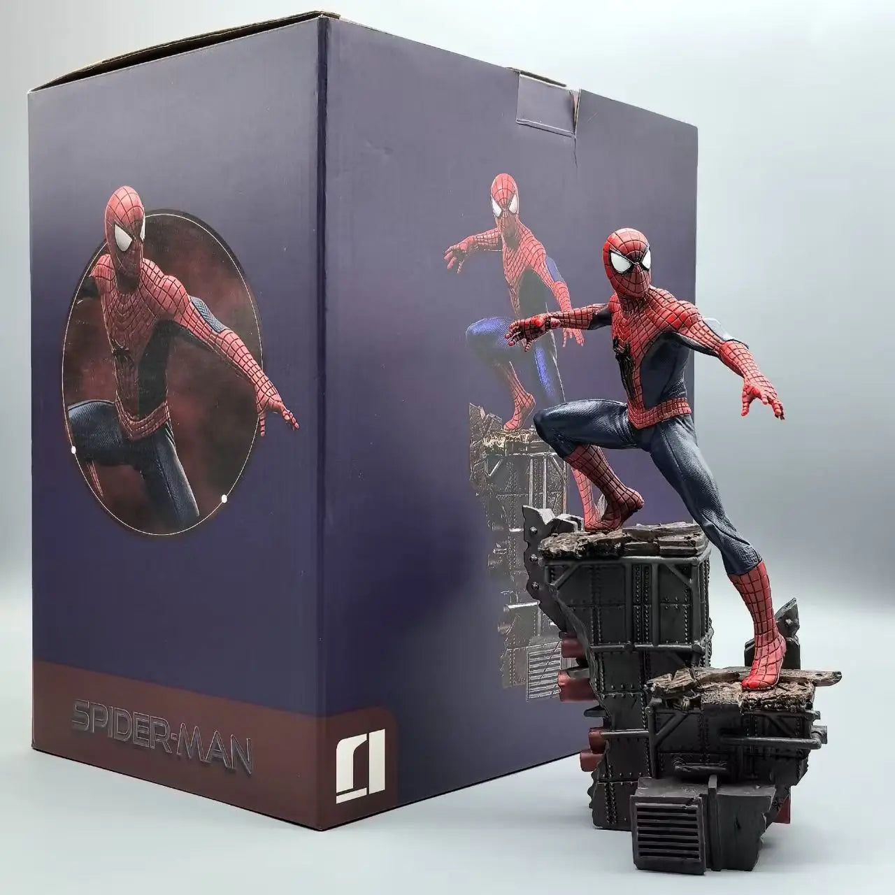 amazing suit spider man figure beside its printed collector box, no way home statue gift for a marvel movie fan, Amazing Suit