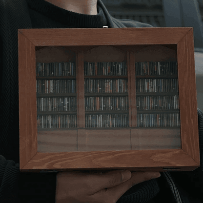 anxiety bookshelf held in hands showing scale mini library with 260 tiny books wellness desk accessory thoughtful gift