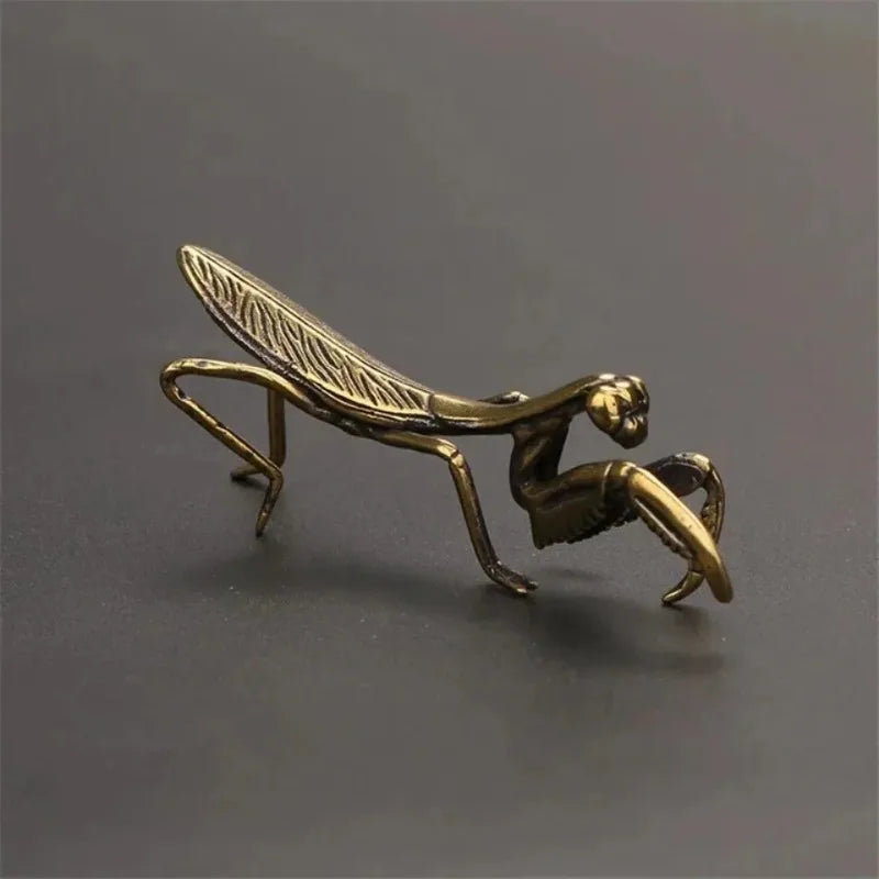 antique brass mantis ornament rear view, vintage style metal insect figurine for shelf and cabinet decor