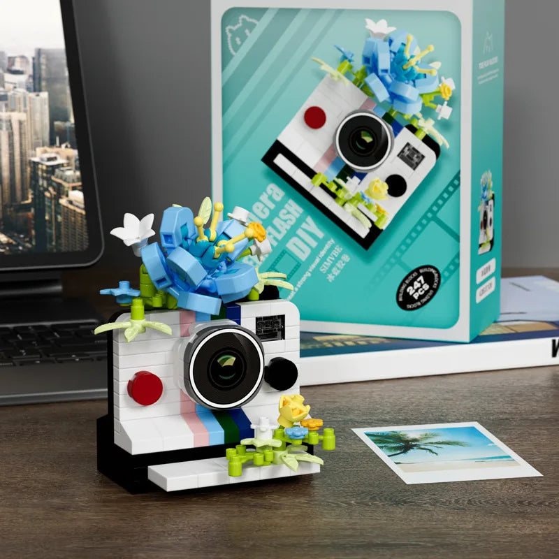 white instant camera building blocks with blue brick flowers, micro block set for a photography student, White