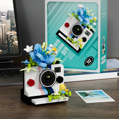 white instant camera building blocks with blue brick flowers, micro block set for a photography student, White