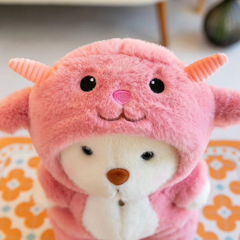 Pink plush toy with a bear face on a floral background