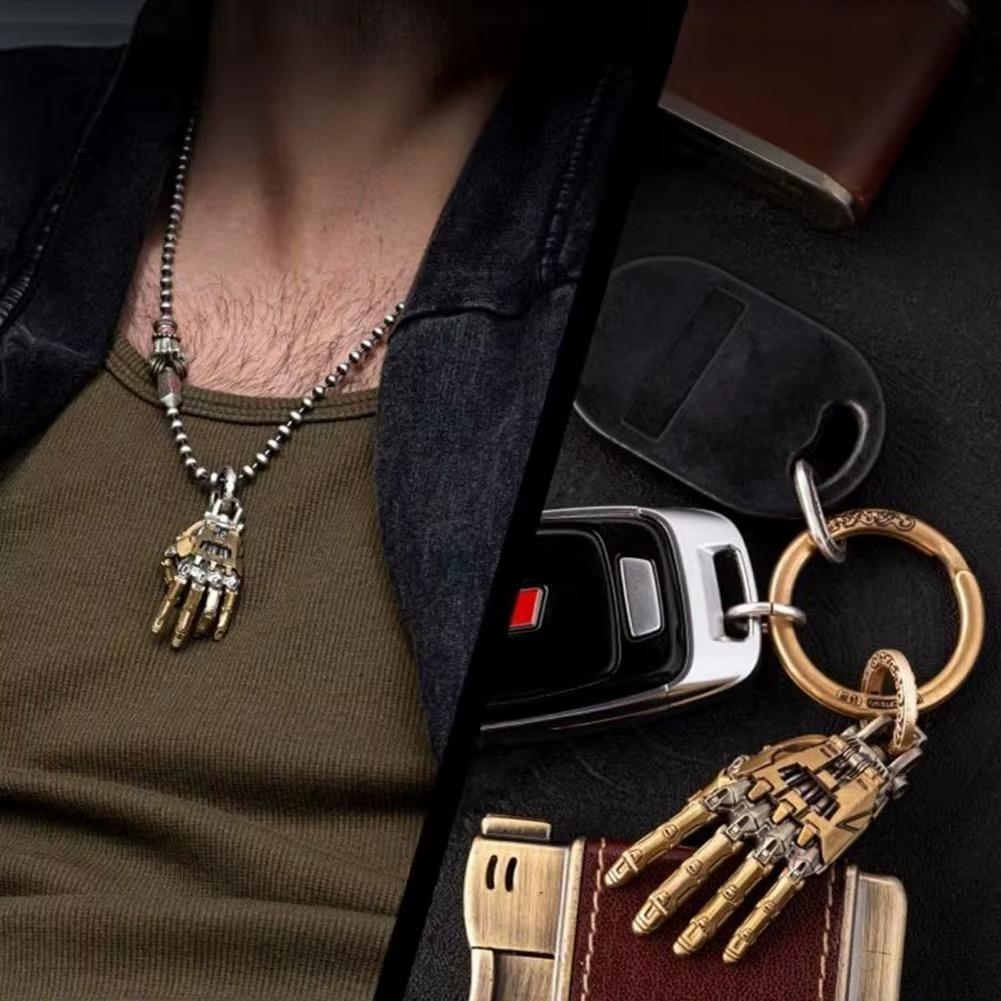 Puzzloria cybernetic hand pendant with articulated joints and steampunk design