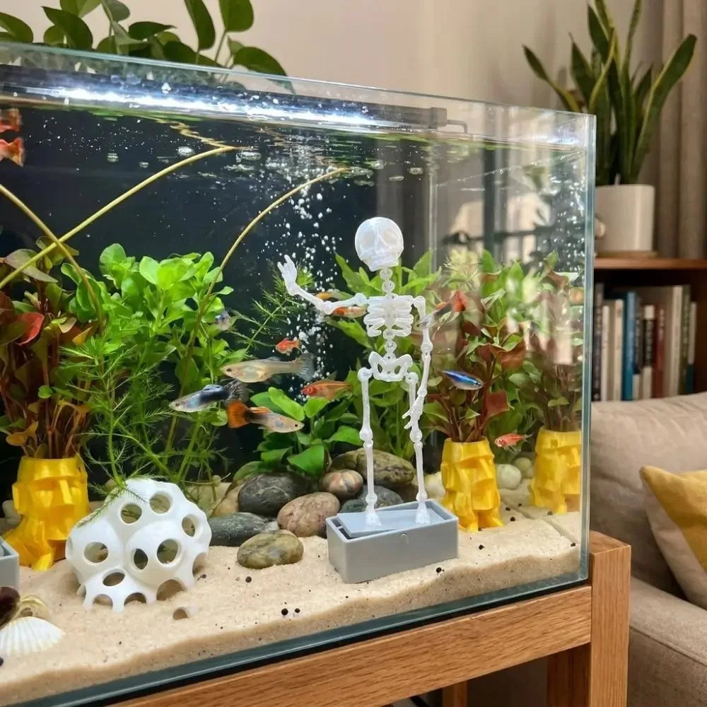 skeleton fish tank ornament in a planted home aquarium as spooky underwater decoration for living room tanks