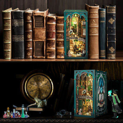 Decorative bookshelf with vintage books and a small illuminated model of a building.