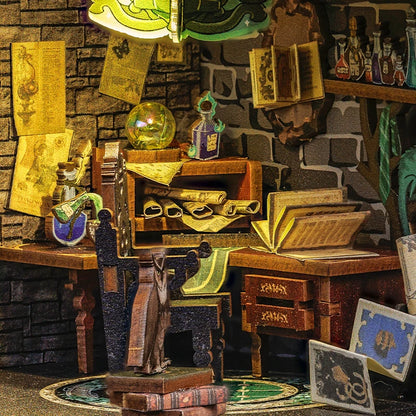 Detailed diorama of a wizard's desk with books, potions, and magical items.