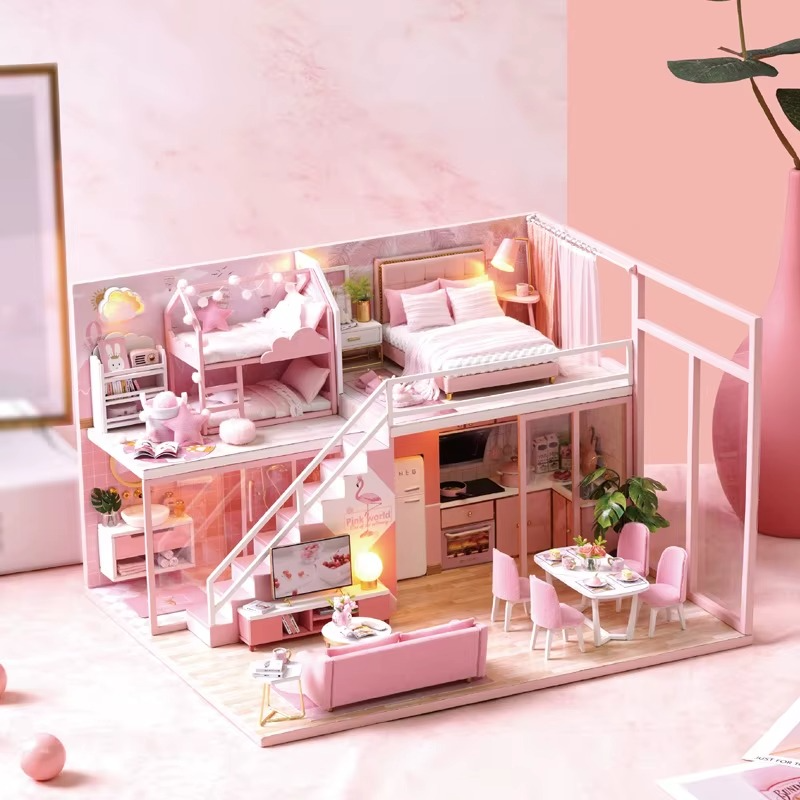 Pink dollhouse with furniture including a bed, desk, and living room. DIY Dollhouse Kit (Apartment)
