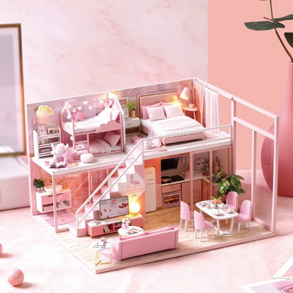 Pink dollhouse with furniture including a bed, desk, and living room. DIY Dollhouse Kit (Apartment)