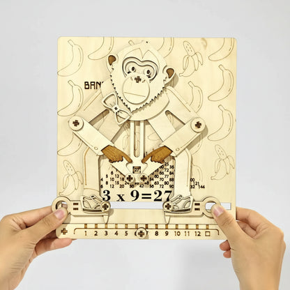 wooden educated monkey multiplication calculator puzzle held in hand 3x9 hands-on math learning gift for homeschool teacher