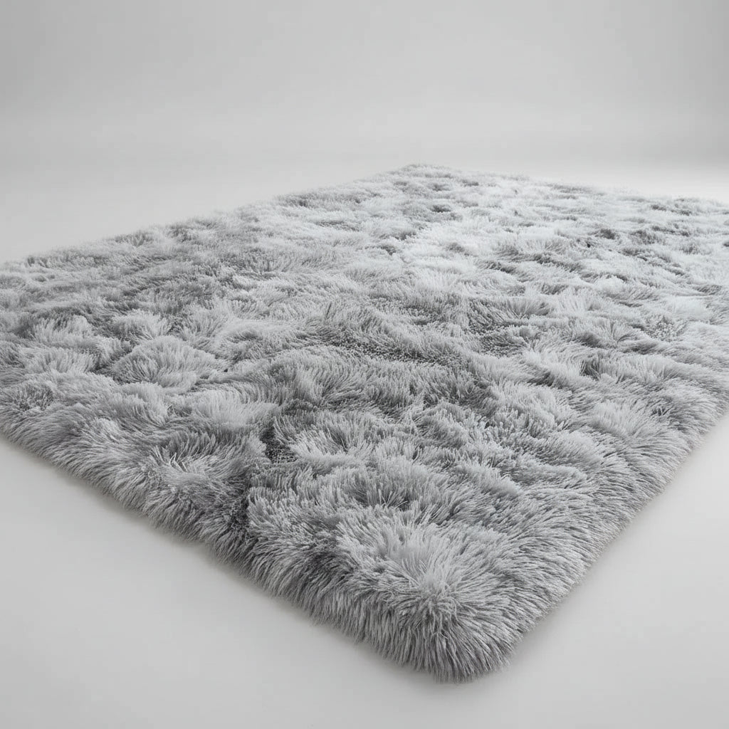 Child playing with a small dog on a fluffy gray rug in a room with colorful wall art.