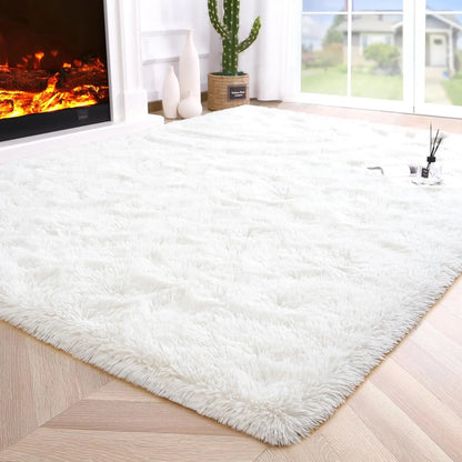 White fluffy rug on a wooden floor with a fireplace and window in the background