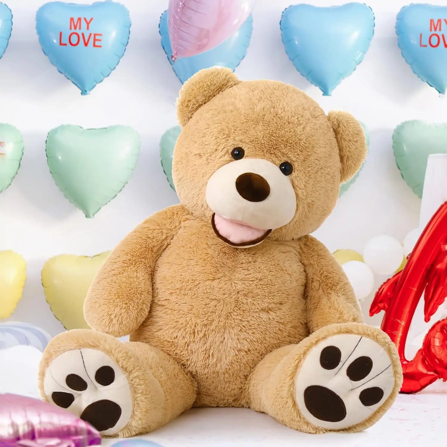 Brown teddy bear surrounded by heart-shaped balloons with 'MY LOVE' text on a white background