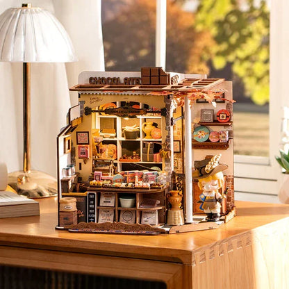led lit dollhouse kit showing the chocolate shop window and signage as warm bedroom and study decor