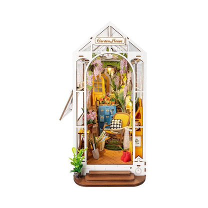 holiday garden house diy book nook kit, lit miniature house bookend that slots between books on a shelf