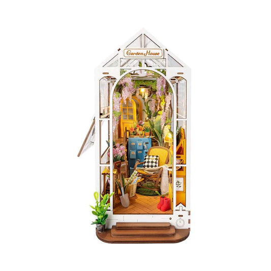 holiday garden house diy book nook kit, lit miniature house bookend that slots between books on a shelf