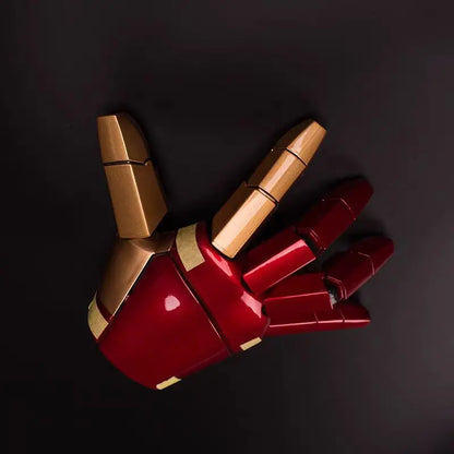 Red and gold mechanical glove on a black background